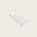 Expandable carbon steel shelf tray, telescopic, on a light rice background