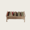 Adjustable steel desk bookshelf holding books, freestanding on a desk