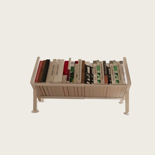 Adjustable steel desk bookshelf holding books, freestanding on a desk