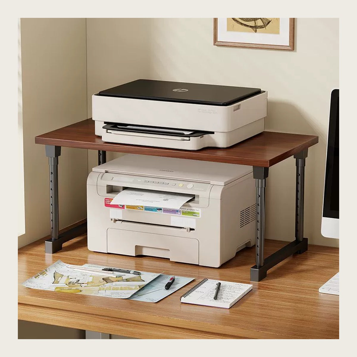 Desk riser on a home-office desk with a printer on top and the lower level in use