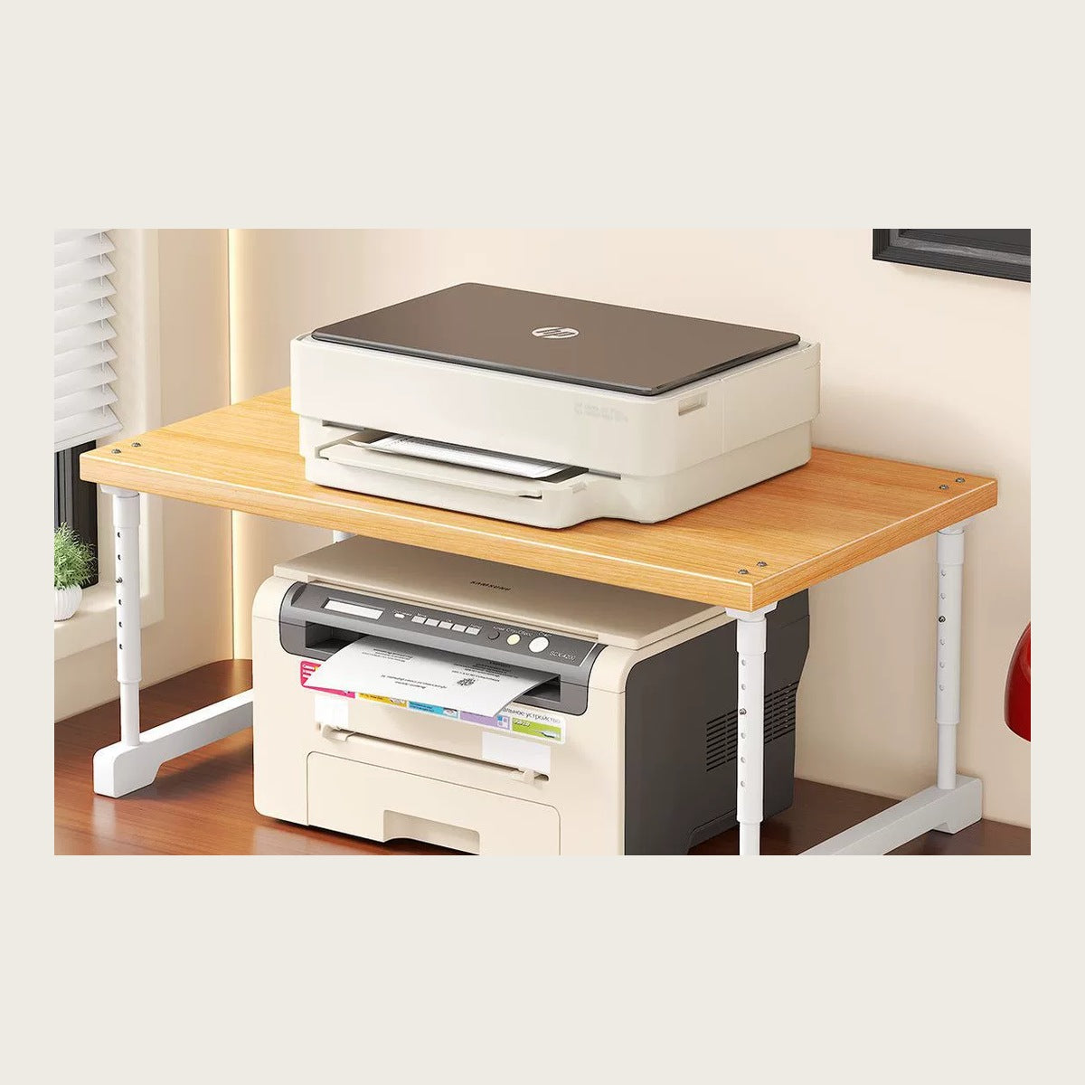 White-frame desk riser lifting a printer so the gap underneath becomes storage